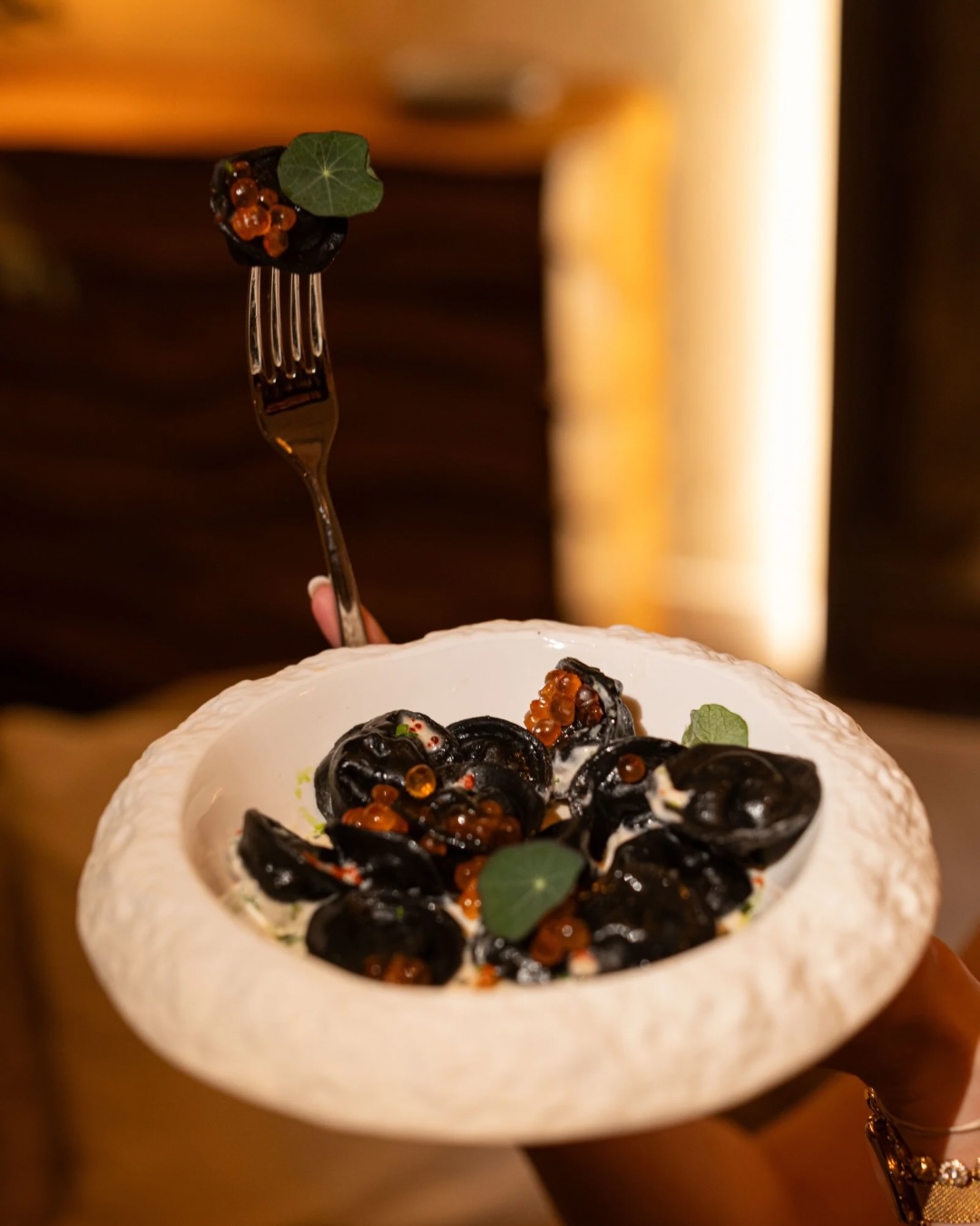 Black varenyky with salmon roe, eastern cuisine reimagined